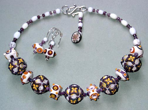  Cluster Beads in this necklace to match a strand of lampwork glass beads 